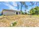 Expansive backyard featuring a well-maintained lawn, and beautiful natural surroundings at 3799 Laredo Ave, North Port, FL 34288
