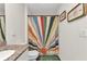 Bathroom with a colorful shower curtain, decorative accents, and neutral flooring at 3799 Laredo Ave, North Port, FL 34288