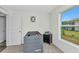 Bright Bedroom featuring a gray crib, modern window and plush carpet, creating a serene and comfortable space at 3799 Laredo Ave, North Port, FL 34288