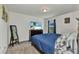 Cozy bedroom with a comfortable bed, TV on dresser, full-length mirror, and soft carpet at 3799 Laredo Ave, North Port, FL 34288