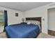 Relaxing bedroom with stylish decor, a comfortable bed, and soft carpeting for a cozy atmosphere at 3799 Laredo Ave, North Port, FL 34288