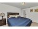 Comfortable bedroom featuring soft carpet, soothing decor, and a well-lit ambiance at 3799 Laredo Ave, North Port, FL 34288