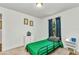 Small bedroom features a twin bed, neutral walls, and natural light from the window at 3799 Laredo Ave, North Port, FL 34288