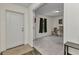 Welcoming entryway with a white front door, leading to a carpeted room with natural light at 3799 Laredo Ave, North Port, FL 34288