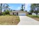 Beautiful single-story home featuring a well-kept lawn, an extended driveway, and an attached two-car garage at 3799 Laredo Ave, North Port, FL 34288