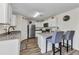 Bright kitchen with granite countertops, modern appliances, breakfast bar, and stylish seating at 3799 Laredo Ave, North Port, FL 34288