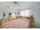 Bright bedroom featuring a bed with built in shelves and dresser, and a ceiling fan at 4055 Alwick Ln, North Port, FL 34287