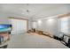 Spacious bonus room with vaulted ceiling, ceiling fan, and multiple windows for ample natural light at 4055 Alwick Ln, North Port, FL 34287