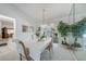 Bright dining area with chandelier and sliding doors at 4055 Alwick Ln, North Port, FL 34287