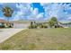 Charming single-story home boasts a manicured front lawn and a two-car garage with curb appeal at 4055 Alwick Ln, North Port, FL 34287