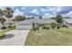 Charming single story home with manicured lawn and mature trees at 4055 Alwick Ln, North Port, FL 34287