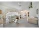Bright living room with plush seating, ceiling fan, and window at 4055 Alwick Ln, North Port, FL 34287