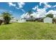 Expansive backyard with well-maintained lawn, shed, and inviting pool area, ideal for relaxation at 416 Allen St, Punta Gorda, FL 33950