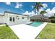 Serene backyard view showcasing a modern pool and outdoor living space at 416 Allen St, Punta Gorda, FL 33950