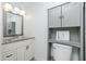 Bathroom featuring a white vanity with granite countertop and toilet with modern fixtures at 416 Allen St, Punta Gorda, FL 33950
