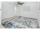 A bright bedroom featuring an area rug, ceiling fan, and two closets for optimal storage at 416 Allen St, Punta Gorda, FL 33950