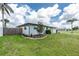 Well-maintained home with a manicured lawn and updated exterior, showcasing curb appeal at 416 Allen St, Punta Gorda, FL 33950