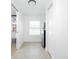 Hallway area with tiled flooring, mini-fridge, and storage closet at 416 Allen St, Punta Gorda, FL 33950