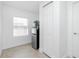 Hallway area with tiled flooring, mini-fridge, and closet at 416 Allen St, Punta Gorda, FL 33950