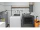 Efficient laundry room with modern washer and dryer set plus a water heater at 416 Allen St, Punta Gorda, FL 33950