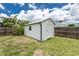 Functional outdoor shed in a fenced backyard, providing ample storage space at 416 Allen St, Punta Gorda, FL 33950