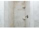 Modern tiled shower featuring corner shelves and sleek fixtures at 416 Allen St, Punta Gorda, FL 33950
