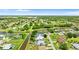 Wide aerial shot of the community highlighting the home’s location on a canal and its proximity to the area's nature at 425 Corrientes Cir, Punta Gorda, FL 33983