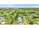 Community aerial view showing the home's position along a serene canal and lush surroundings at 425 Corrientes Cir, Punta Gorda, FL 33983