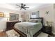 Charming bedroom with a dark wood bed frame, decorative accents, and hardwood flooring at 425 Corrientes Cir, Punta Gorda, FL 33983