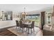 Elegant dining area with large windows and sophisticated furnishings at 425 Corrientes Cir, Punta Gorda, FL 33983