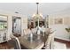 Formal dining room features sophisticated decor and stylish chandelier at 425 Corrientes Cir, Punta Gorda, FL 33983