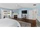 Spacious main bedroom featuring a fireplace, vaulted ceilings, and plenty of natural light at 425 Corrientes Cir, Punta Gorda, FL 33983