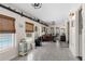 Spacious office featuring tile floors, built-in shelving, and a view of the pool area at 425 Corrientes Cir, Punta Gorda, FL 33983