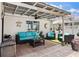 Inviting outdoor patio featuring comfortable seating and stylish decor under a shaded pergola at 425 Corrientes Cir, Punta Gorda, FL 33983