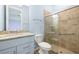 Bathroom featuring a walk-in tiled shower, granite counters and blue vanity at 43406 Boardwalk Loop, Punta Gorda, FL 33982