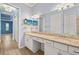 Bathroom with double sinks, granite countertops, recessed lighting, and modern fixtures at 43406 Boardwalk Loop, Punta Gorda, FL 33982