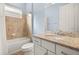 Bathroom featuring granite countertop and tiled shower over tub at 43406 Boardwalk Loop, Punta Gorda, FL 33982