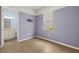Bedroom with wood floors, large window, and view into the adjacent bathroom at 43406 Boardwalk Loop, Punta Gorda, FL 33982