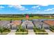 Stunning single-story home with well manicured landscaping and beautiful water view and golf course backdrop at 43406 Boardwalk Loop, Punta Gorda, FL 33982