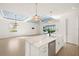 Beautiful kitchen with an island, stainless steel appliances, and open view to the living areas at 43406 Boardwalk Loop, Punta Gorda, FL 33982