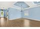 Open living area with views of the front yard and stylish light fixtures at 43406 Boardwalk Loop, Punta Gorda, FL 33982