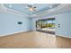 Bright living room with sliding glass doors leading to the outdoor living area and pool at 43406 Boardwalk Loop, Punta Gorda, FL 33982