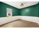 Cozy office space with wainscoting, stylish light fixture, and natural light from the window at 43406 Boardwalk Loop, Punta Gorda, FL 33982