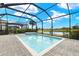 The backyard features a screened-in pool, spa and beautiful water views at 43406 Boardwalk Loop, Punta Gorda, FL 33982