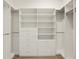 Walk-in closet with built-in shelves and drawers providing ample storage space at 43406 Boardwalk Loop, Punta Gorda, FL 33982
