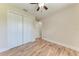 Spacious bedroom featuring wood-look floors and closet at 4380 Maddock Cir, North Port, FL 34286