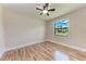 Comfortable bedroom with hardwood floors and natural light from the window at 4380 Maddock Cir, North Port, FL 34286