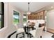 Cozy breakfast nook with a round table, four chairs, and a view of the outdoors at 4380 Maddock Cir, North Port, FL 34286