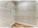 Walk-in closet with installed shelving and hardwood floors at 4380 Maddock Cir, North Port, FL 34286