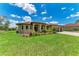 Charming single-Gathering home with a well-manicured lawn and tropical landscaping at 4380 Maddock Cir, North Port, FL 34286